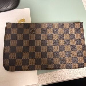 New brown checkered pouch for purse never used. L V